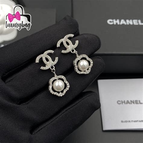 chanel pearl silver earrings.